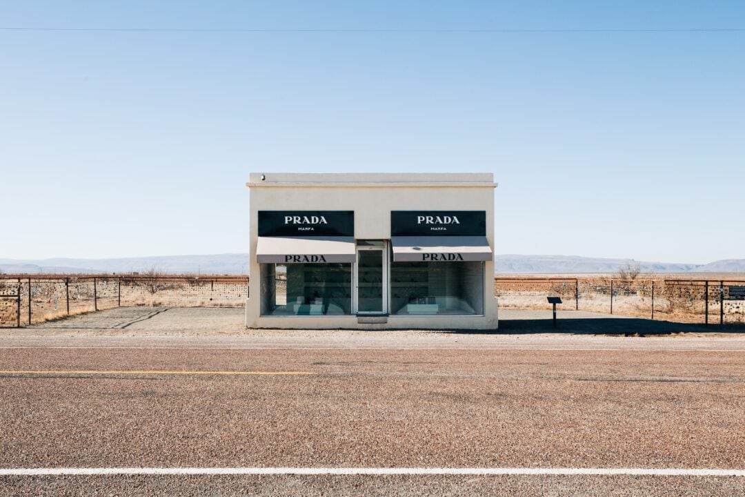The storefront façade for Prada Marfa stands alone on a lonely stretch of road