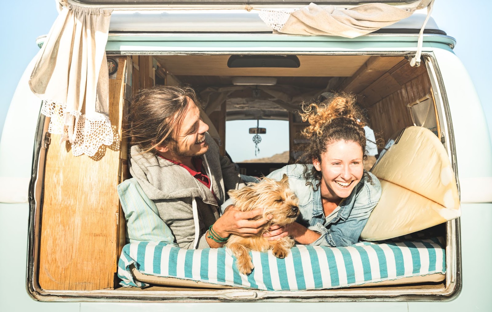 Couple on camping road trip with dog