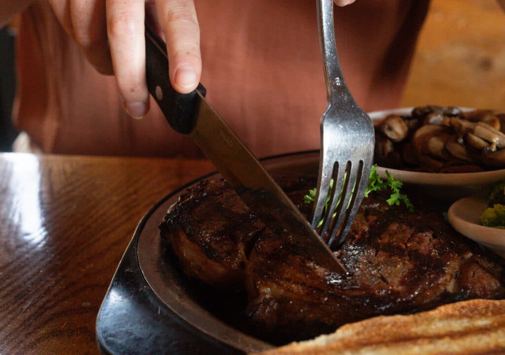 Cutting a steak, Montana